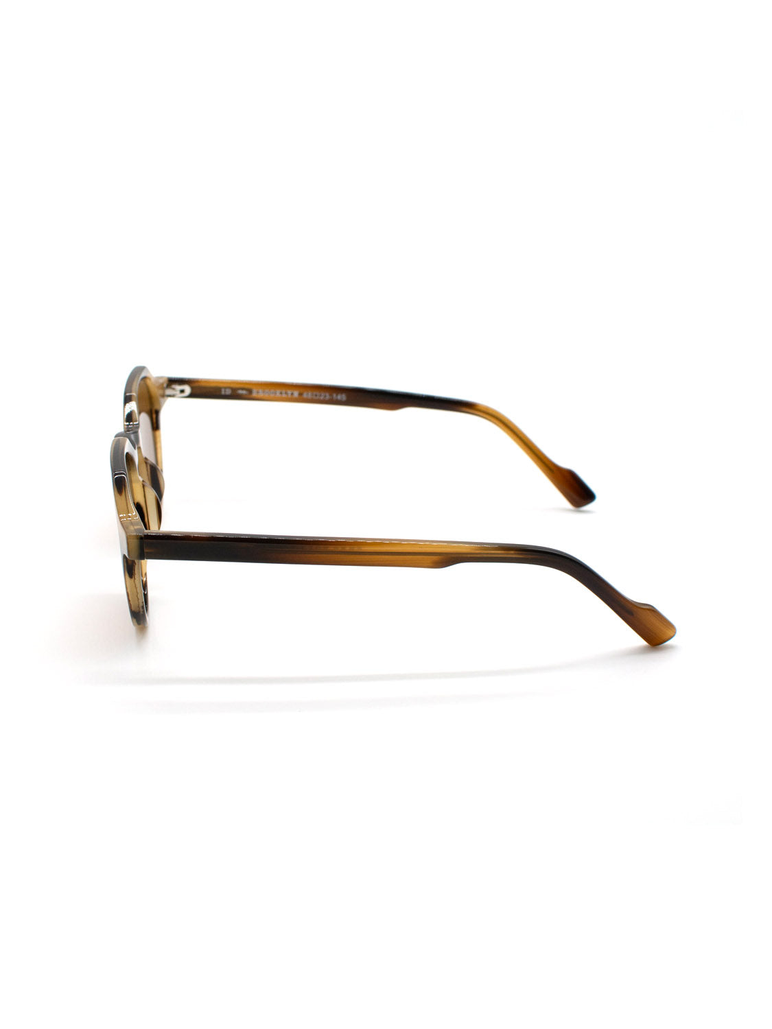 Side view of A343C35B ID Polarized Sunglasses by ID Menswear, featuring round lenses and curved temple arms, crafted from Mazzucchelli Acetate and displayed on a white background.