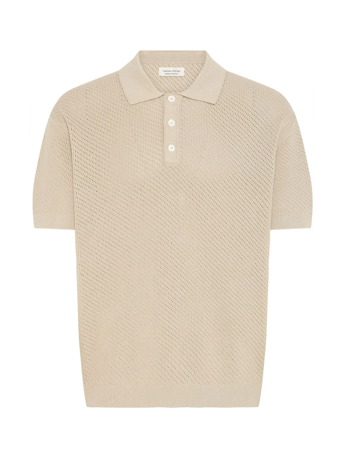 The Cfisaksson Polo Knit by Casual Friday is a beige short-sleeve polo made from 100% cotton, with a textured pattern, collar, and three-button placket, shown laid flat on a white background.