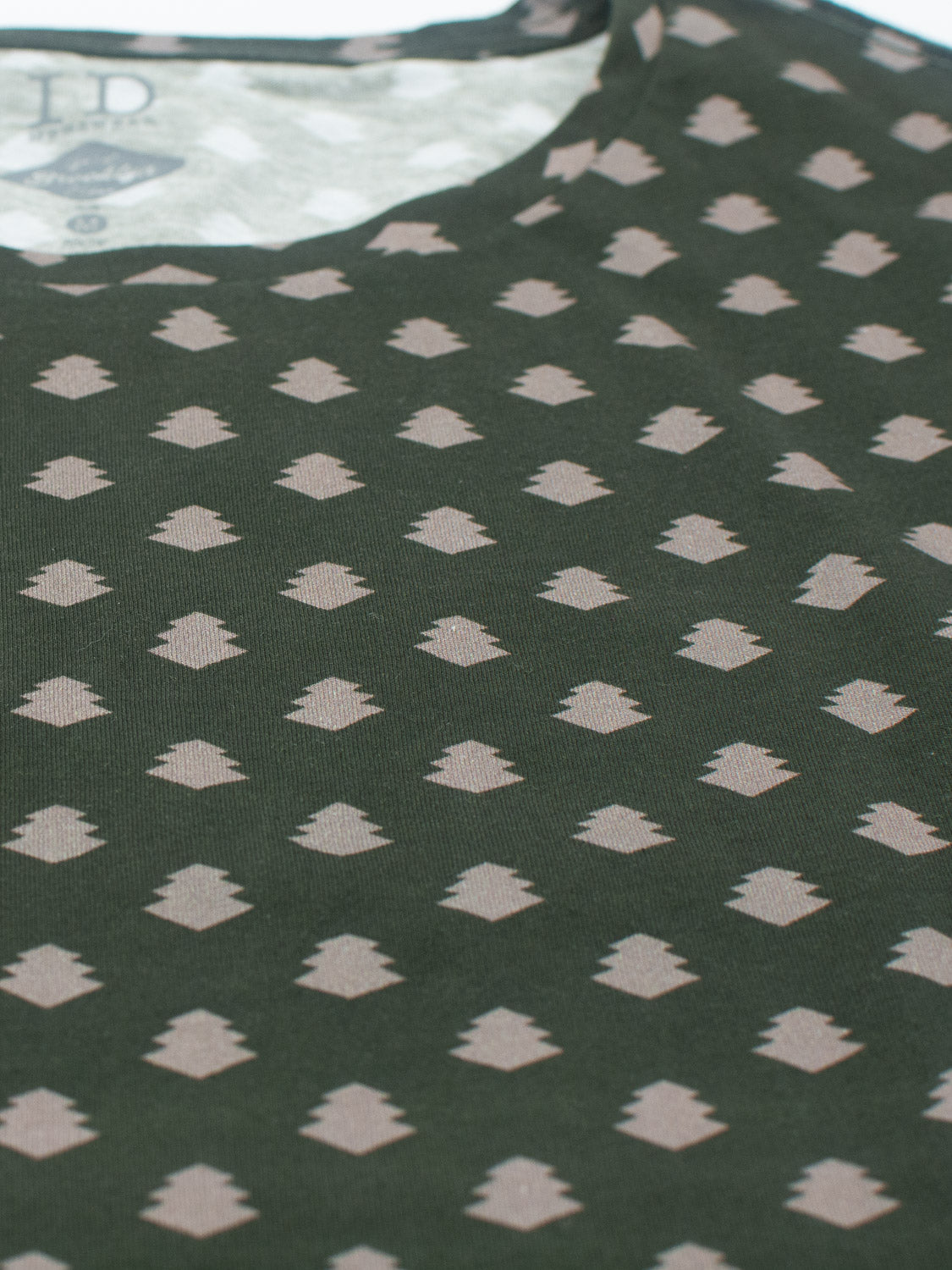 The Bali Vintage Japanese Print Tee by ID Menswear is a dark green fabric with small, evenly spaced beige diamond shapes in rows, reminiscent of classic Japanese designs.