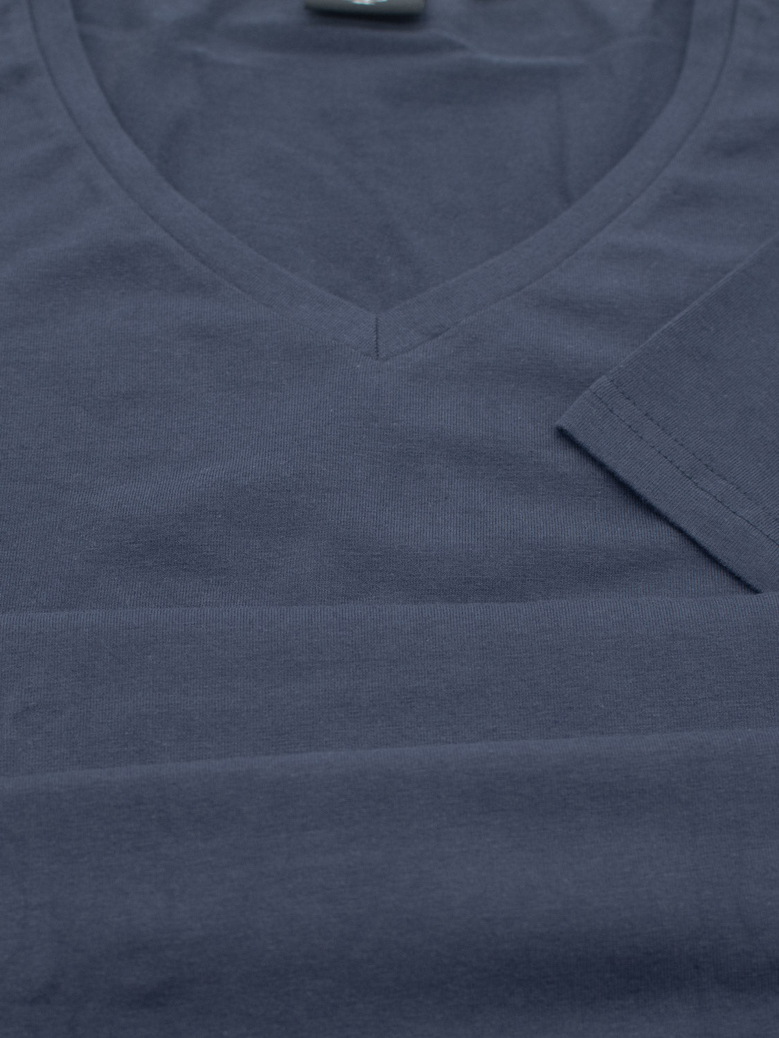 A Form V Neck Tee by ID Menswear, this dark gray, form-fitting T-shirt highlights the neckline and short sleeve with its soft, uniformly colored fabric—ideal for casual occasions.