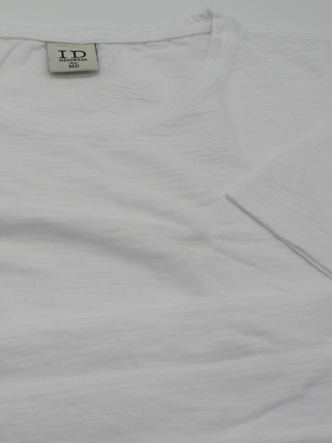 The Mini Flip Slub Yarn Tee by ID Menswear is a plain white, short-sleeved, crew neck T-shirt in size M. Featuring a brand logo inside the neckline, it is soft and lightweight, ideal for everyday casual wear.