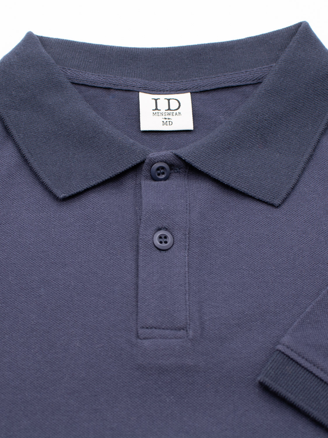 A dark blue Ranger Classic Cotton Mesh Polo by ID Menswear features a collar and three buttons, made from lightweight cotton. A small label inside the collar reads ID Menswear MD. The shirts sleeve and body appear against a plain white background, highlighting its classic style.