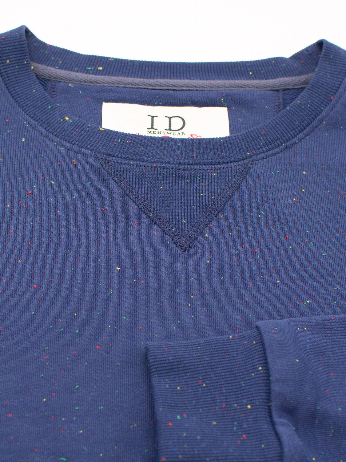 The ID Menswear Stardust Speckled Sweatshirt in navy is made from speckled cotton yarn with multicolored accents. It boasts a ribbed collar, folded sleeves, and includes a white label with text sewn inside the neckline, providing a regular fit.
