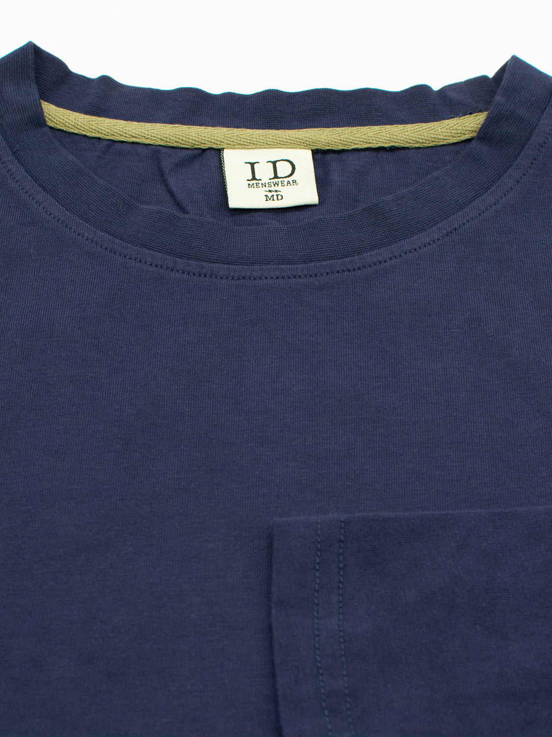 A navy blue Sublime Long Sleeve Tee by ID Menswear is displayed. This casual, organic cotton T-shirt features a round neck and a small pocket on the lower right side, with fabric that appears soft and smooth.