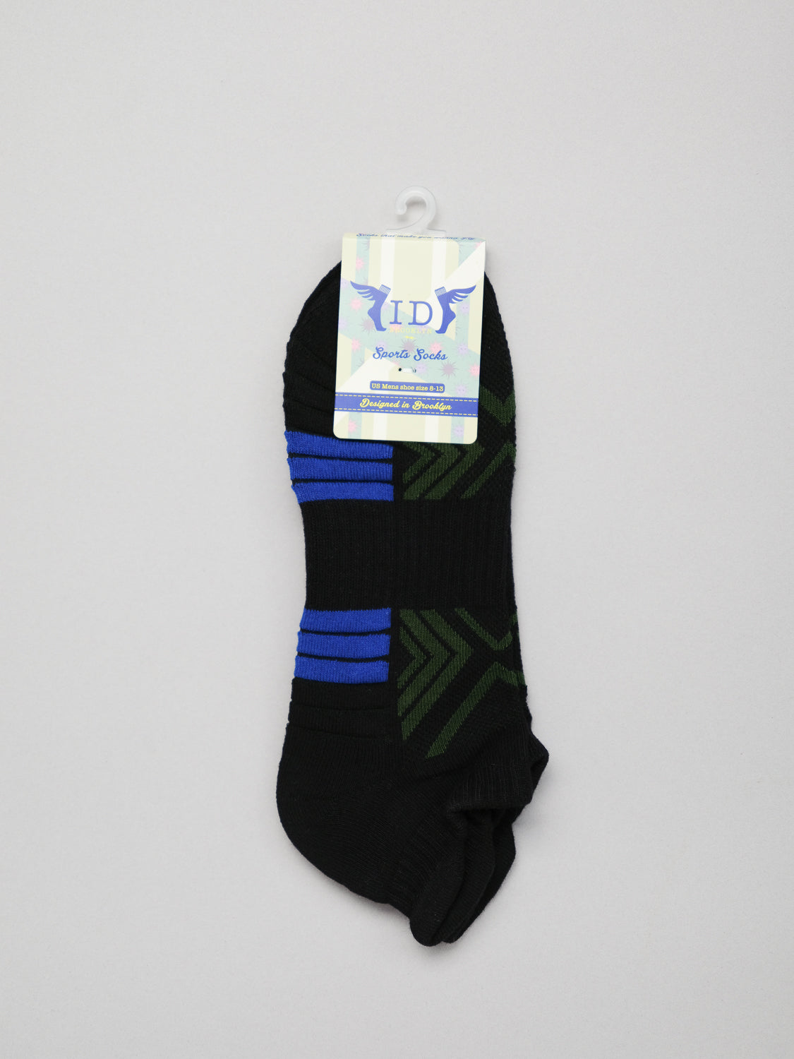 Ankle Sports Socks by ID Menswear are ankle-length, black with blue and green geometric patterns. They offer extra cushioning and are displayed on a plain background, hanging from a labeled hanger showcasing the brand logo.