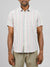 A person wearing the lightweight, regular fit Streak Cotton Shirt by ID Menswear, featuring short sleeves, multicolored vertical stripes, and a left chest pocket stands against a plain background with light-colored pants.