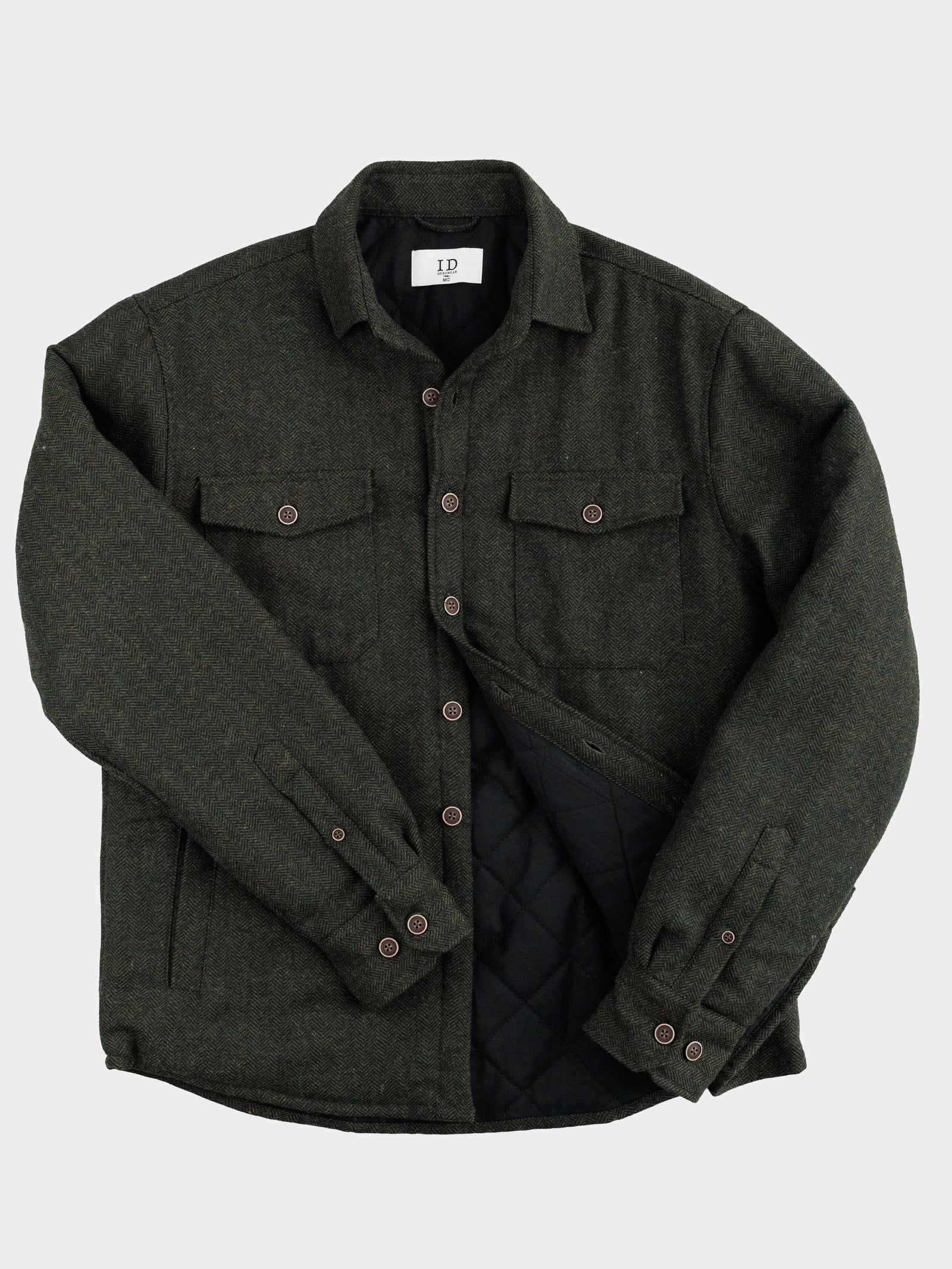 The Stuntman Wool Blend Tweed Jacket by ID Menswear features dark green tweed, a collar, button-up front, two chest flap pockets, side pockets, and quilted lining—timeless outerwear shown on a plain white background.