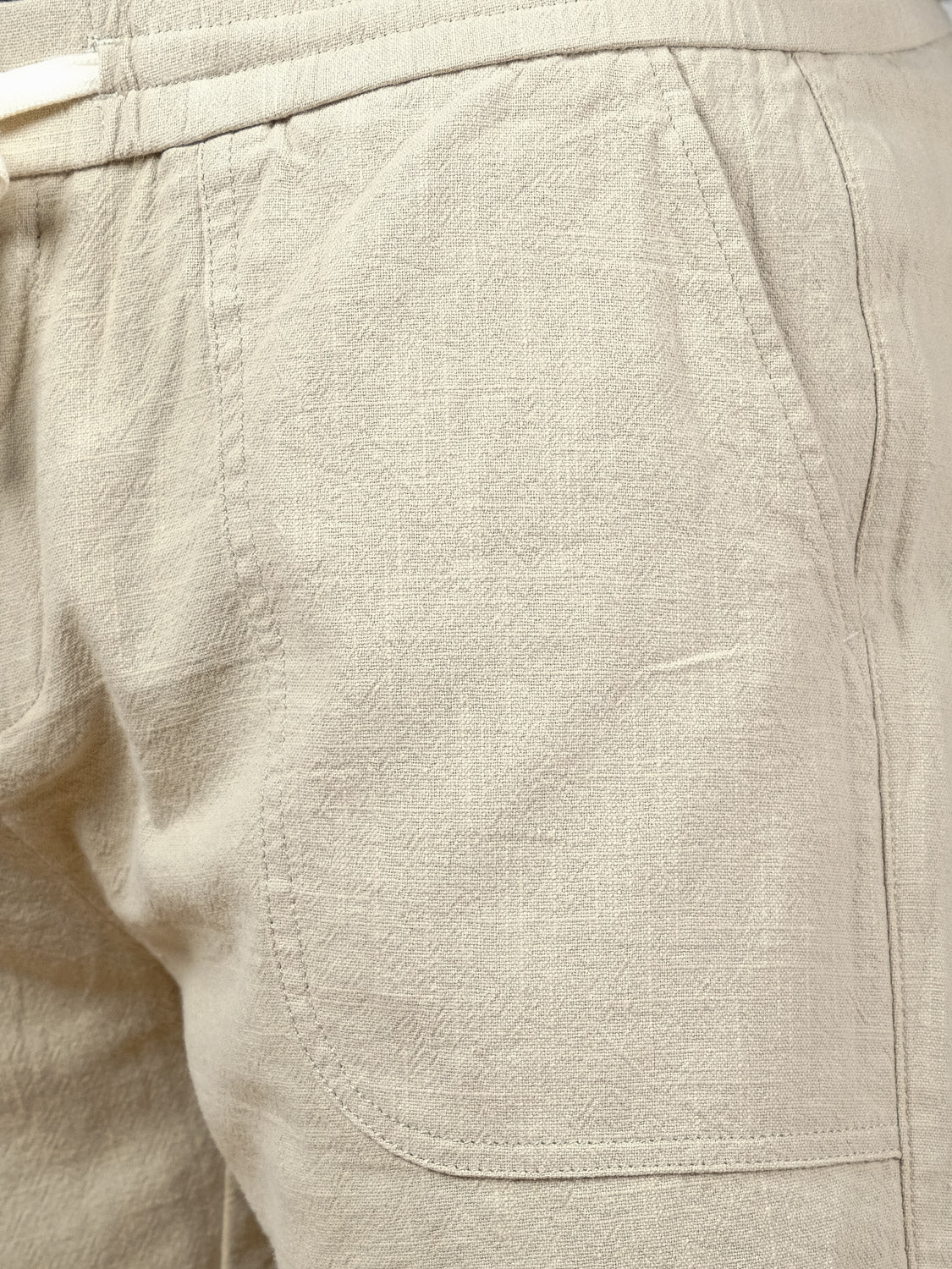 Close-up of the Phi Phi Linen Blend Drawstring Short by ID Menswear, highlighting the left side pocket, elastic waistband for comfort, and textured fabric. Visible stitching details add to the relaxed, stylish look.