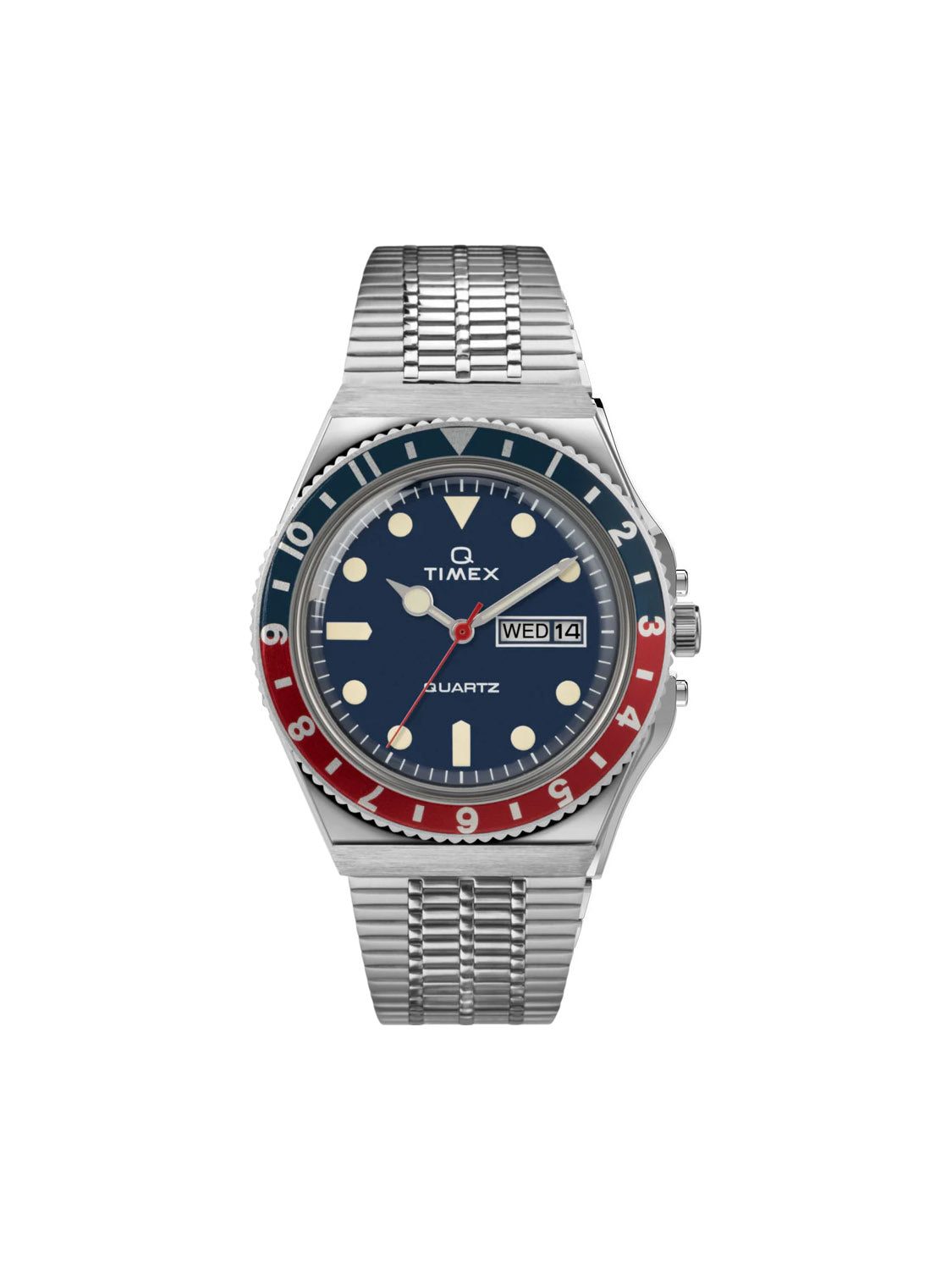 The Timex Q Timex Reissue 38mm Stainless Steel Bracelet Watch features a blue dial, red and blue bezel, white hour markers, silver band, day-date display (WED 14), and is powered by reliable quartz movement.
