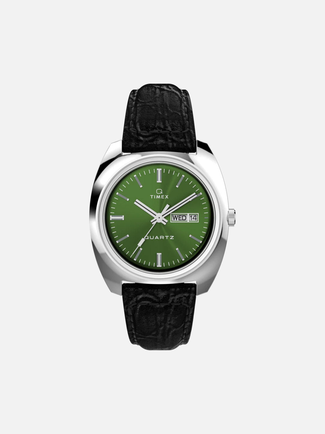 The Timex Q Timex 1978 Day/Date is a retro dress watch with a green dial, silver case, black leather strap, day-date display on the right, silver hour markers, and &quot;Timex&quot; plus &quot;Quartz&quot; on the dial.
