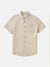 The Katin Alan Solid Shirt by Katin features a single chest pocket, flat collar, and brown buttons. This short-sleeve button-up offers versatile style and high-quality material, shown on a plain white background.