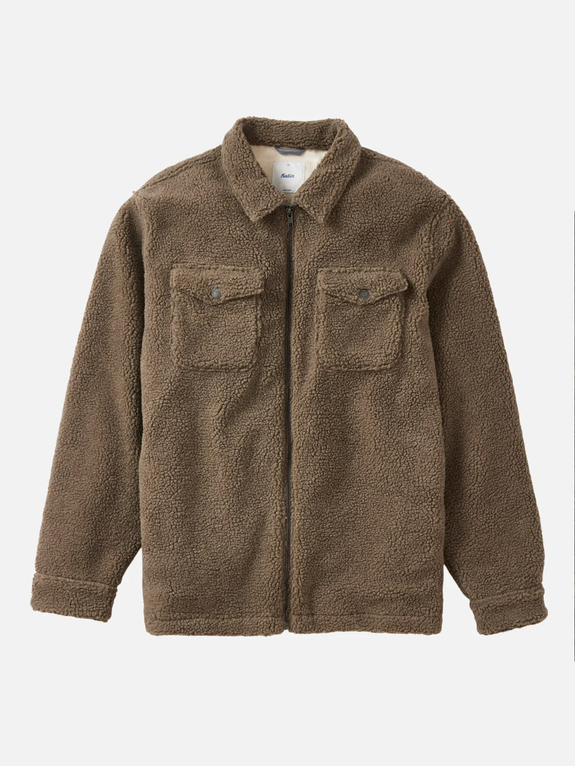 The Katin Anderson Sherpa Jacket is a brown, long-sleeve zip-up with a collar and two buttoned chest pockets, made from soft polyester sherpa. Shown on a plain white background.