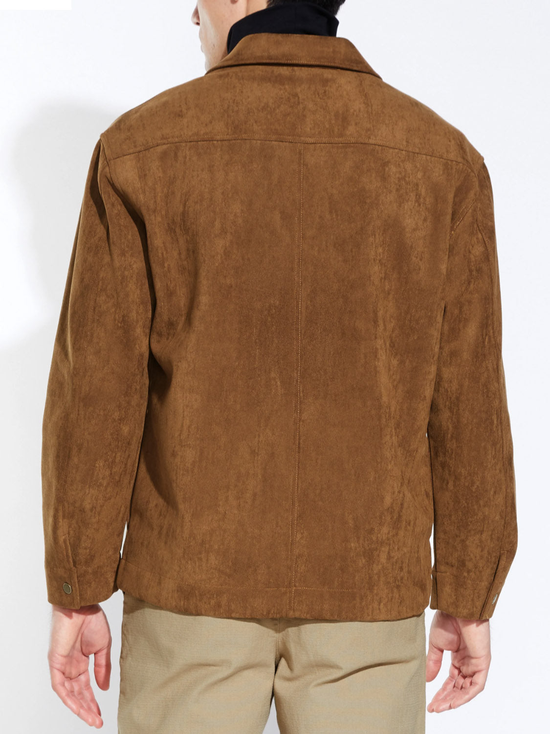 A person wearing the Civil Society Ansel Boxy Fit Suede Shirt Jacket and beige pants is shown from behind, arms relaxed at their sides, standing against a plain white background.