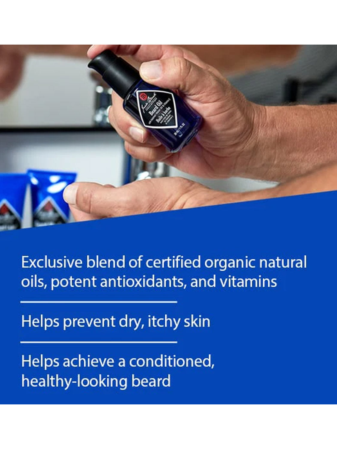 A hand holds a Jack Black Beard Oil bottle above a blue banner showcasing its benefits: conditions beard, contains organic natural oils, antioxidants, and vitamins to prevent dry skin and nourish facial hair.
