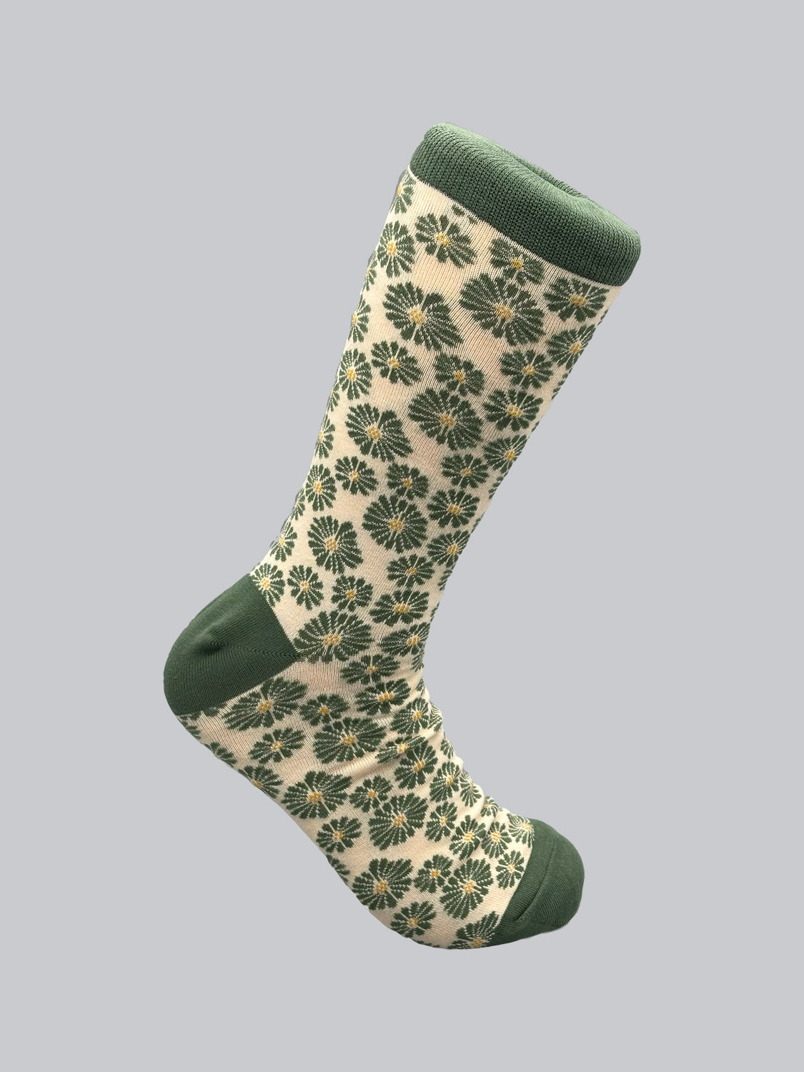 Introducing the Beckia Graphic Socks by ID Menswear: crafted from combed cotton, these breathable, high-quality socks feature cream fabric with elegant green floral designs and solid green accents on the toe, heel, and cuff. Displayed against a plain gray background, they blend style and comfort.