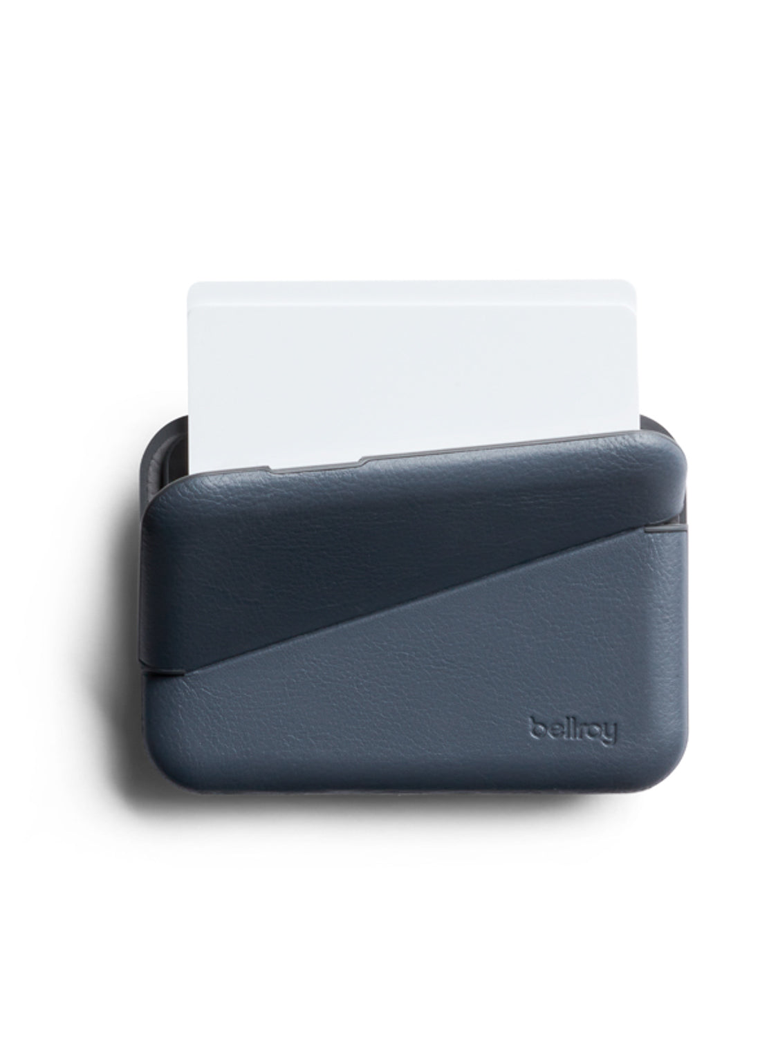 A dark blue Bellroy Flip Case Wallet made from eco-tanned leather with a geometric design, shown holding a single white card partially slid out from the top.