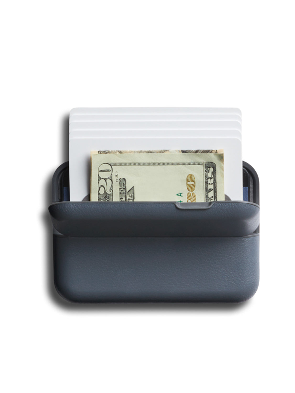 The Bellroy Flip Case Wallet in dark gray eco-tanned leather holds several white cards and a folded twenty-dollar bill, both neatly organized inside, shown on a white background.