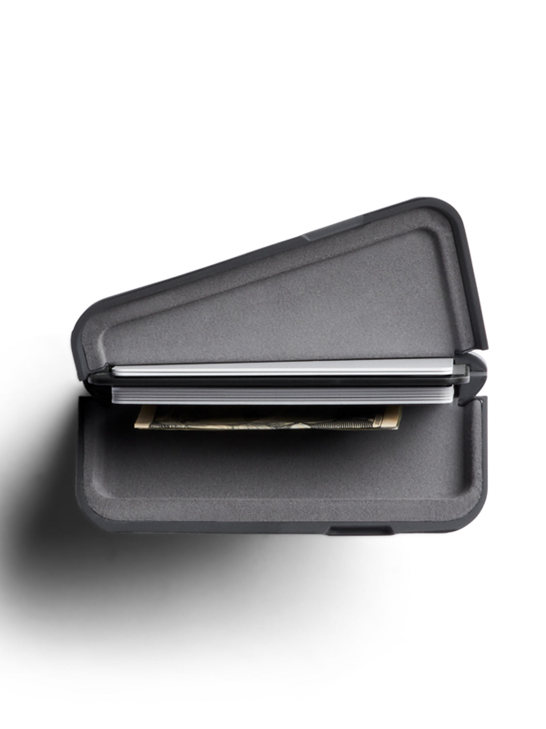 The Bellroy Flip Case Wallet, crafted from eco-tanned leather with RFID protection, is a black, hard-shell double-sided wallet shown partially open on a white background, revealing cards and a banknote inside with its shadow to the left.