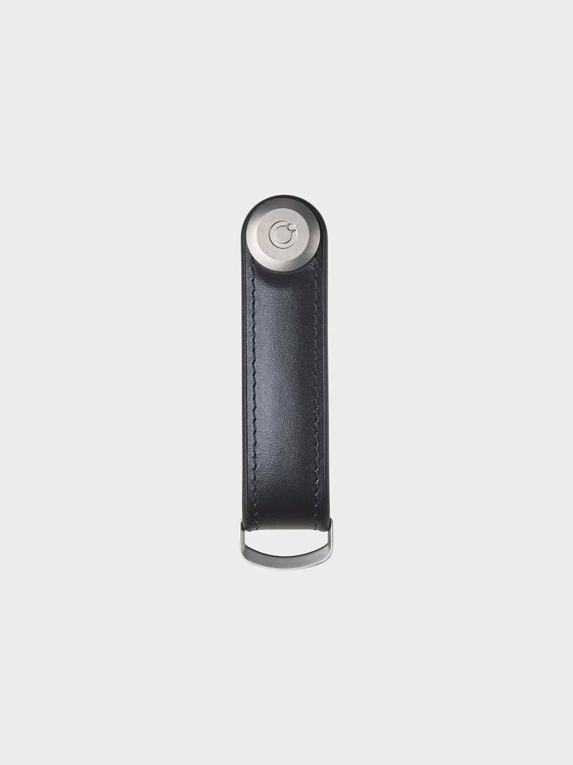 The Orbitkeys Key Organizer Hybrid Leather features Nappa leather, a silver metal button, a metal loop, and secure locking mechanism, displayed against a plain white background.