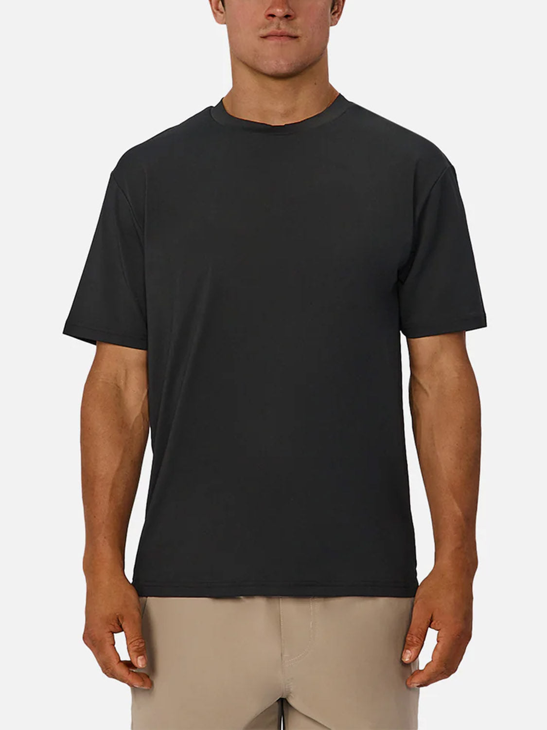 A person faces forward against a white background, wearing the Industrie Boldon T-Shirt in plain black and beige shorts. This lightweight, moisture-wicking athletic tee offers comfort and style for any activity.