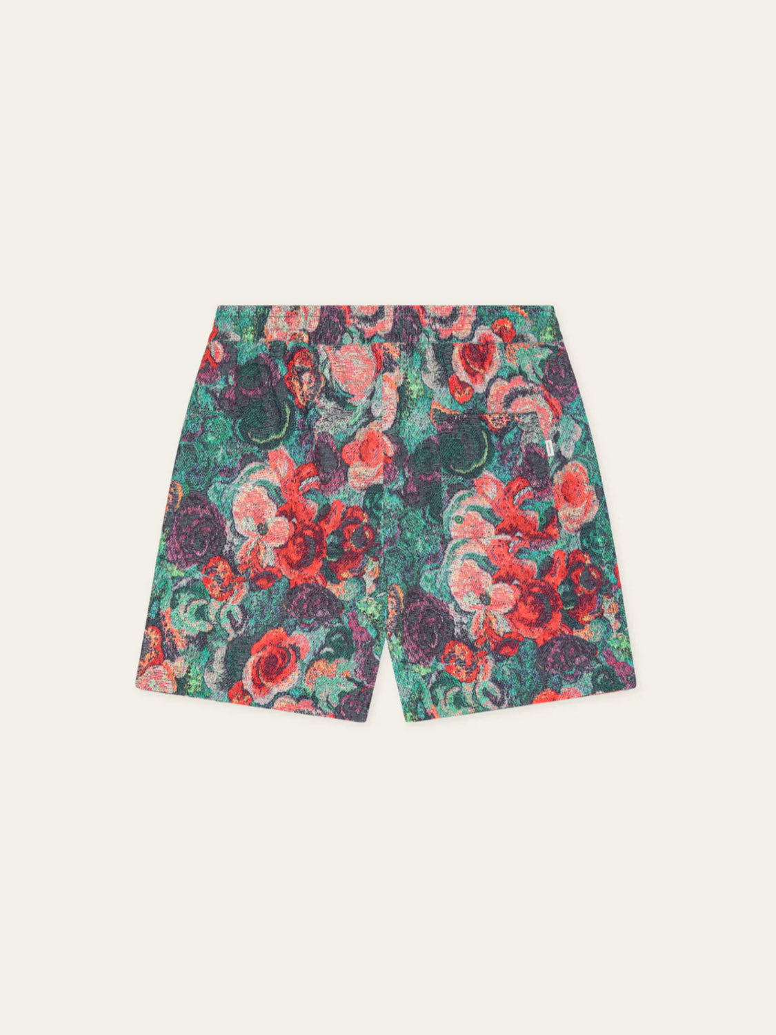 Les Deux Bouquet AOP Swim Shorts feature a vibrant floral pattern in red, green, purple, and coral tones, shown flat on a light background.