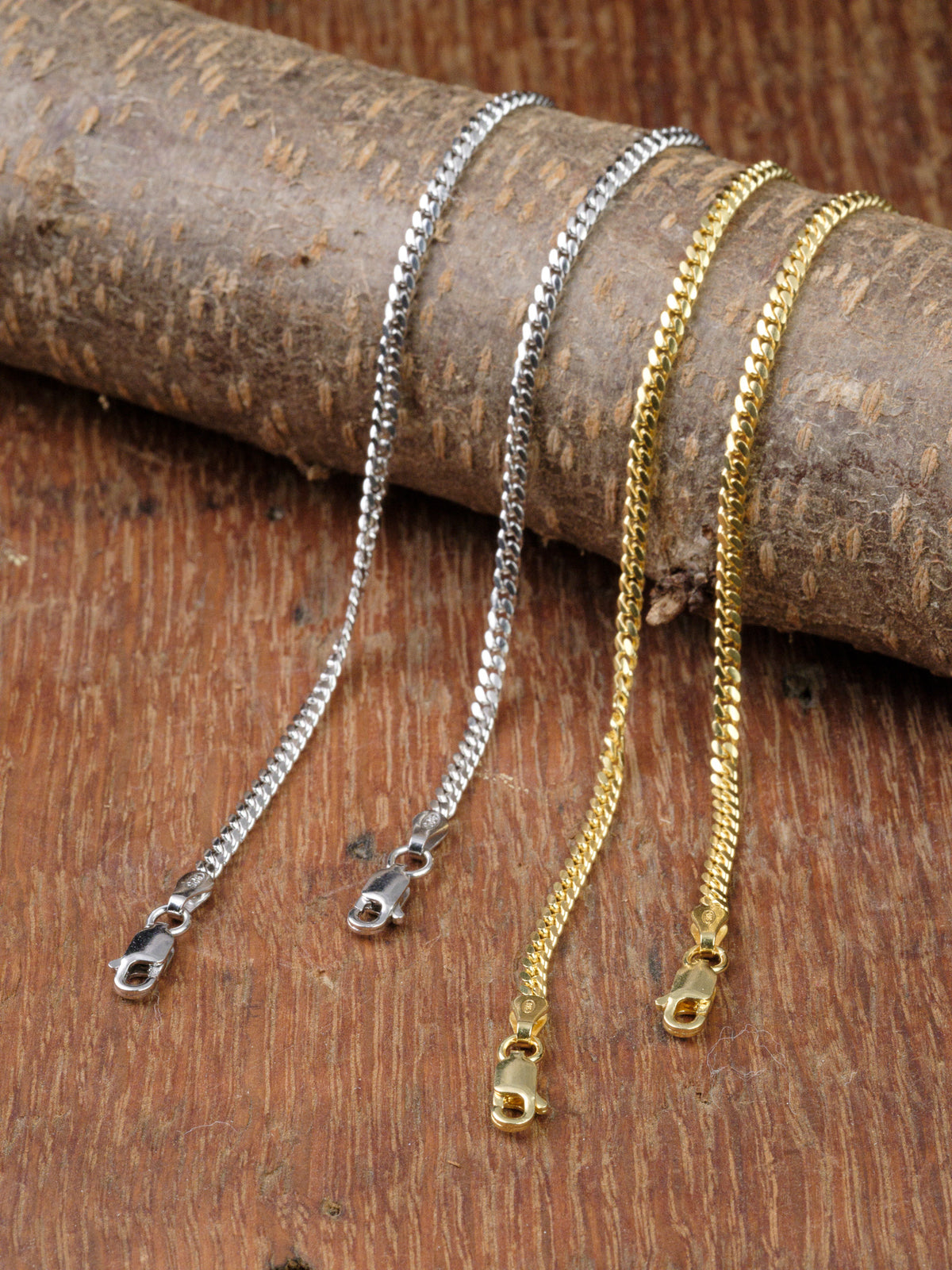 The Blaze 80 Miami Cuban Bracelet by ID Menswear is displayed on textured brown wood, featuring a secure lobster clasp for easy wear.