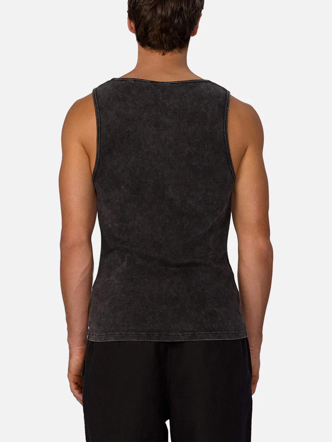A person is seen from behind wearing the Industrie Washed Brando Ribbed Tank Top, styled with black shorts against a plain white background—an ideal addition to a summer wardrobe.