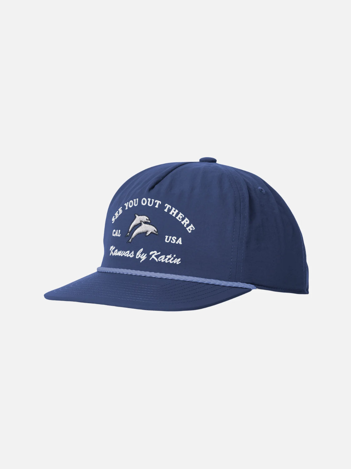 The Breach Hat by Katin is a blue 5-panel cap made from recycled nylon, featuring white "SEE YOU OUT THERE CAL USA" embroidery, a dolphin graphic, Kansas by Katin text, and a flat brim.