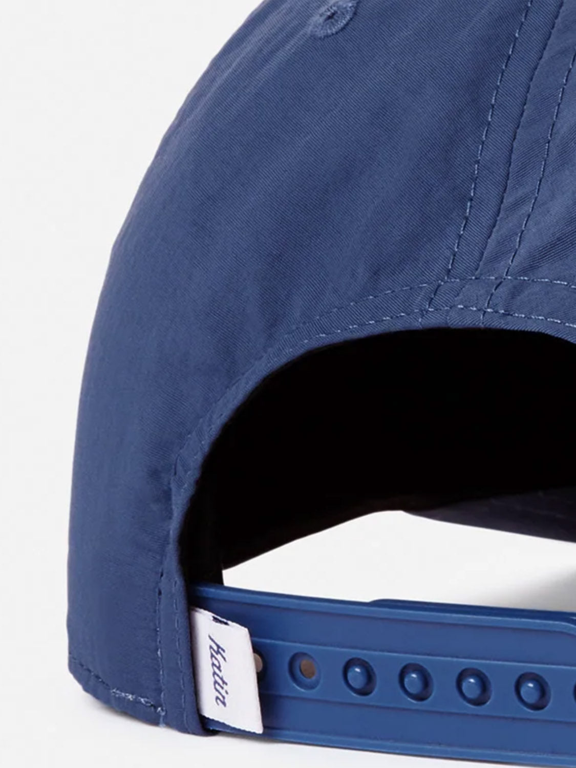 Close-up of the back of the blue Katin Breach Hat, featuring visible stitching, an adjustable snap closure, and a small white tag stitched with "future.