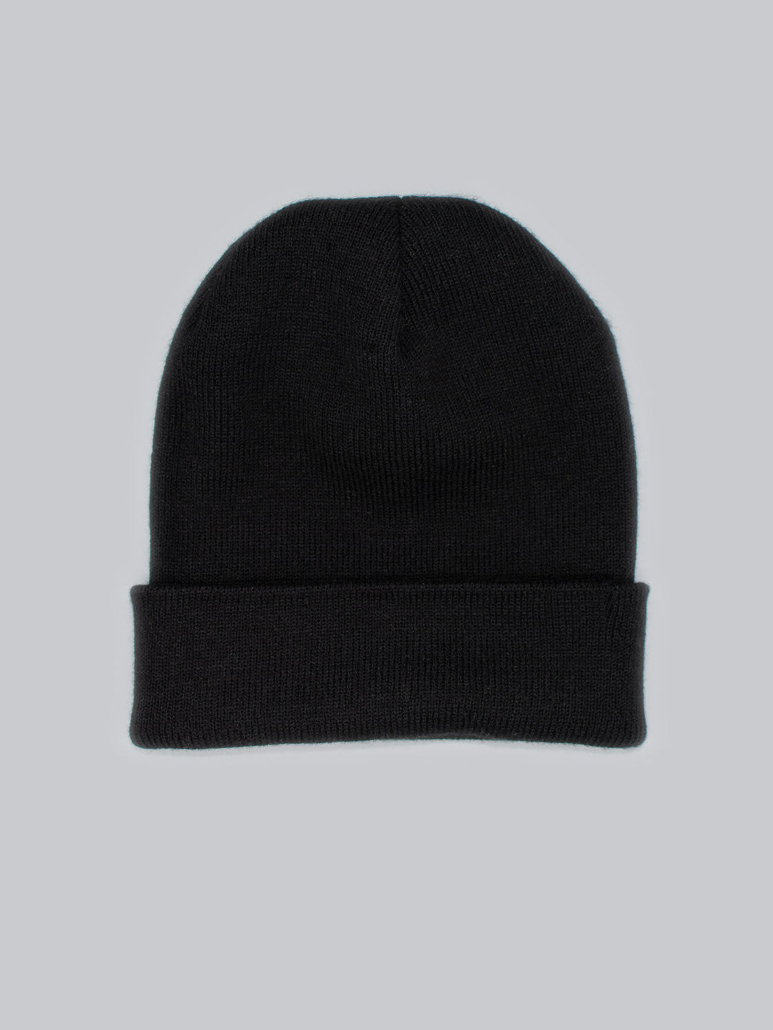 A plain Bronx Acrylic Beanie from ID Menswear sits on a light gray background. Its soft acrylic fabric has a stretchable design and folded brim for warmth and style.