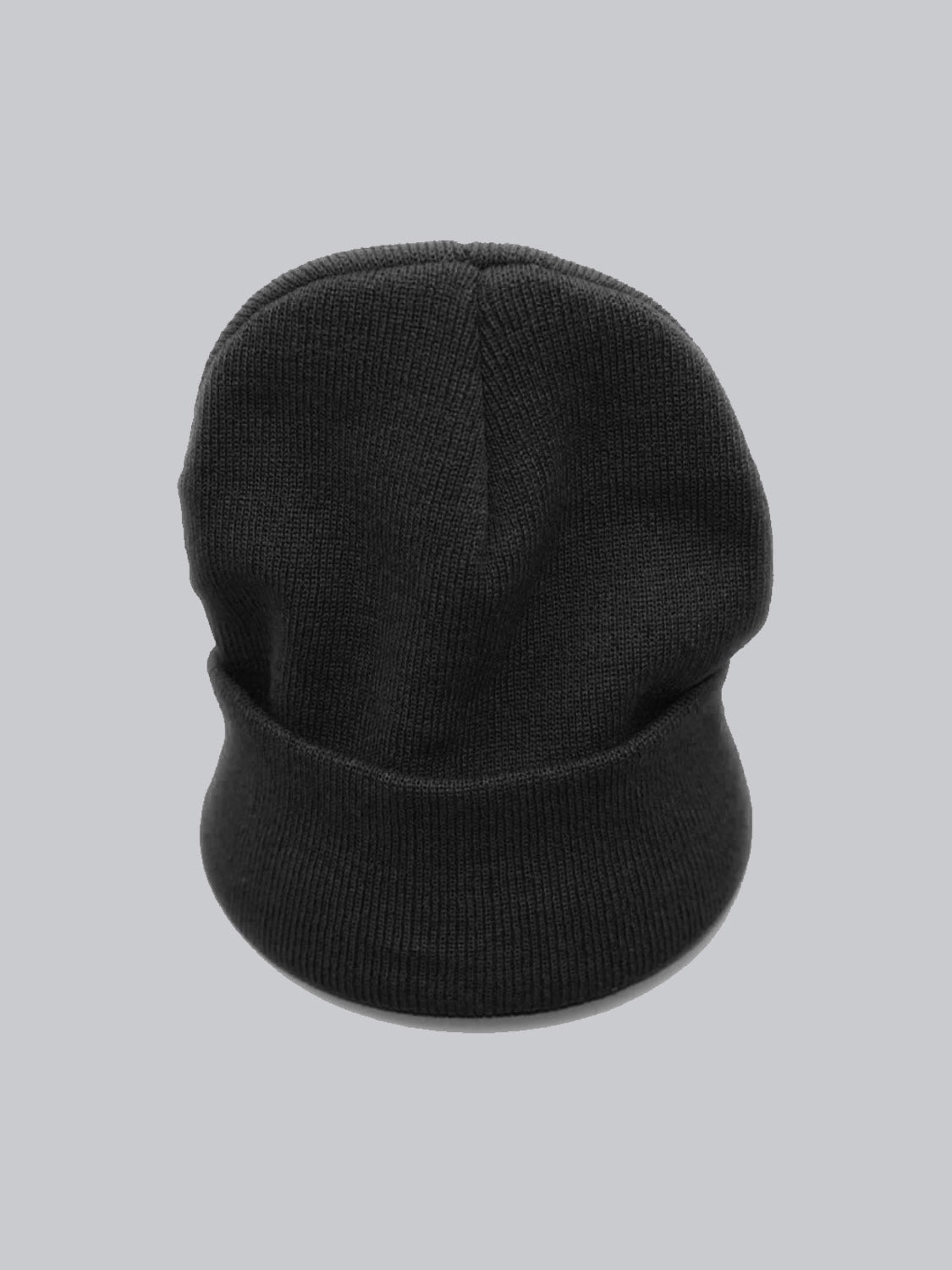 An ID Menswear Bronx Acrylic Beanie, black and soft with a folded brim and stretchable design, rests on a plain gray background—perfect for casual cold-weather wear.