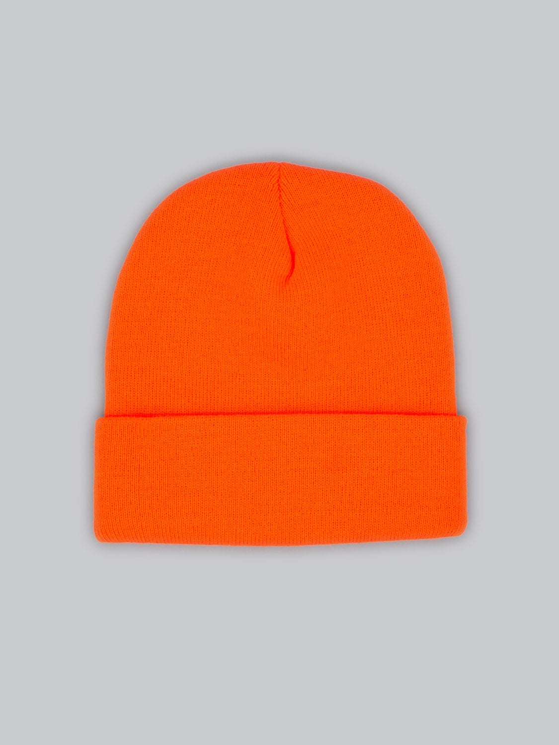 The Bronx Acrylic Beanie by ID Menswear is a vivid orange beanie on a gray background, showcasing a simple, cuffed acrylic design with stretchable fabric.