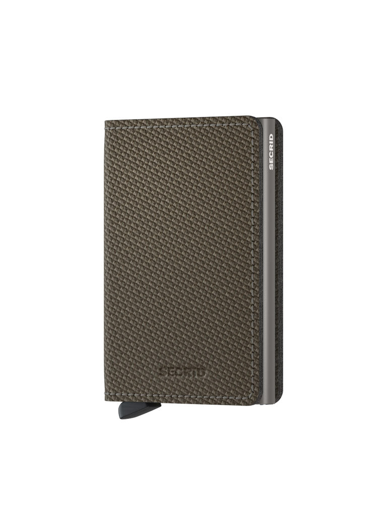 The Secrid Slimwallet Carbon Fibre Pattern Leather features a brown textured finish, black tab, and metal side. This slim leather wallet offers RFID protection and a sleek design, shown closed against a white background.