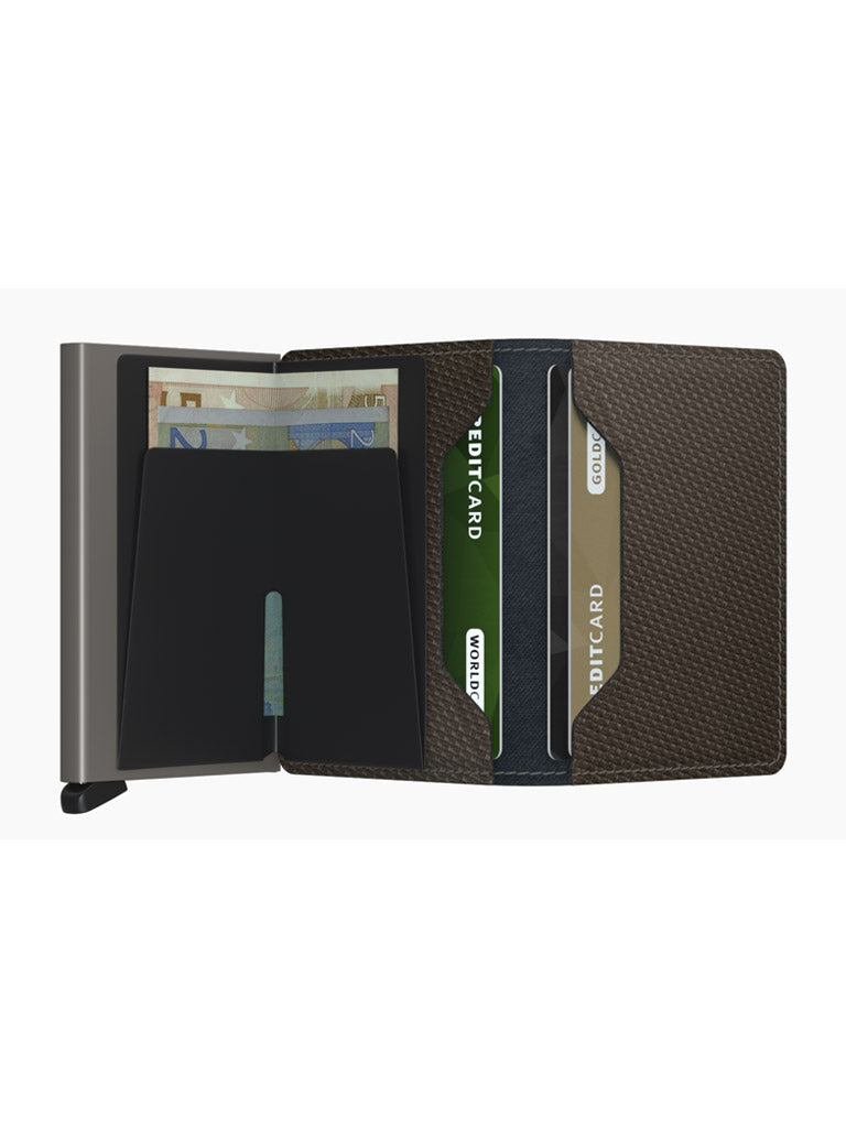 The Secrid Slimwallet Carbon Fibre Pattern Leather is shown open, displaying euro notes and credit cards organized in RFID-protected slots and a central money clip, all against a white background.