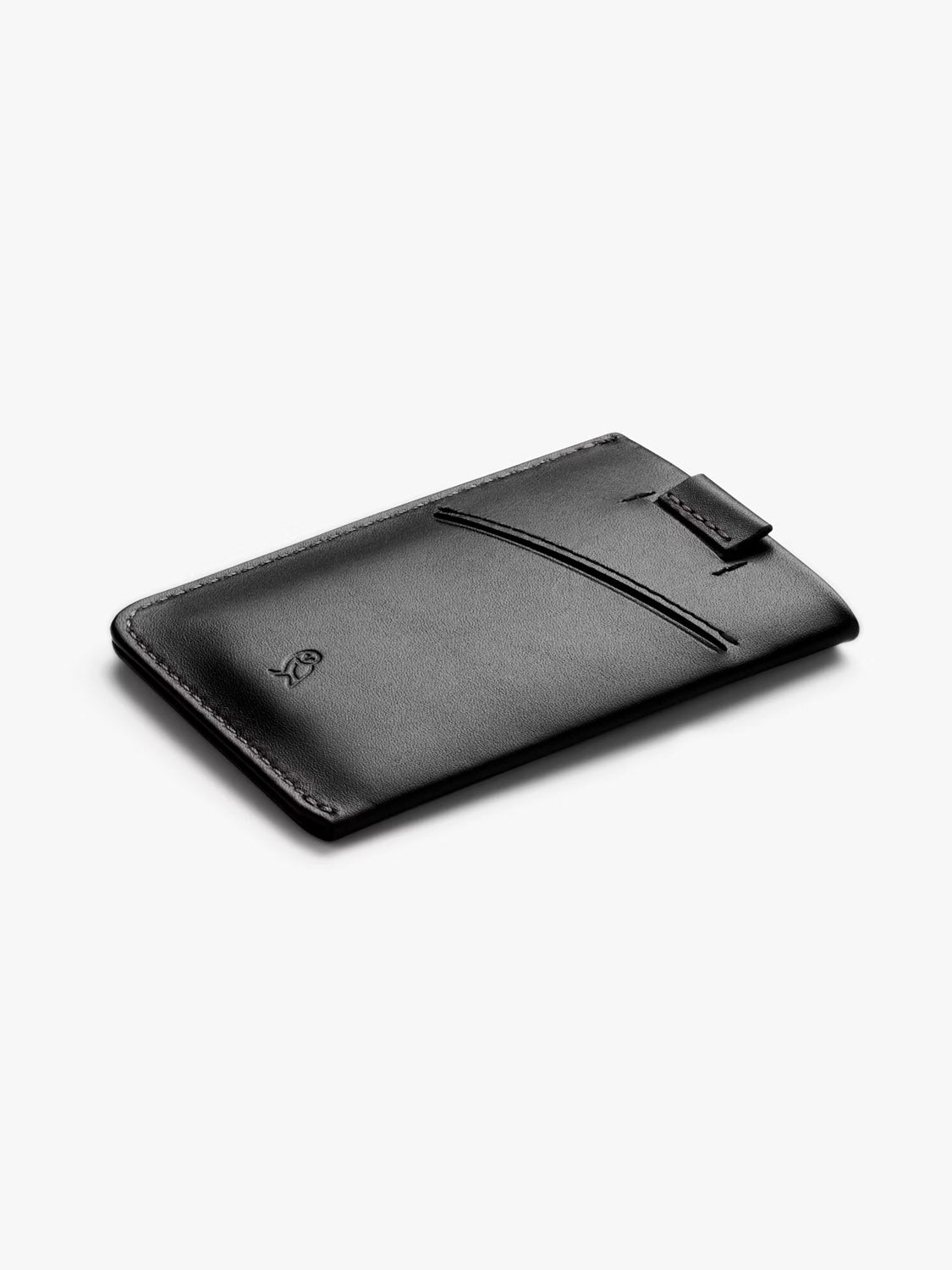 The Bellroy Card Sleeve Wallet is a slim black leather wallet with a side pocket and top tab, doubling as a minimalist business card holder and shown elegantly against a plain white background.