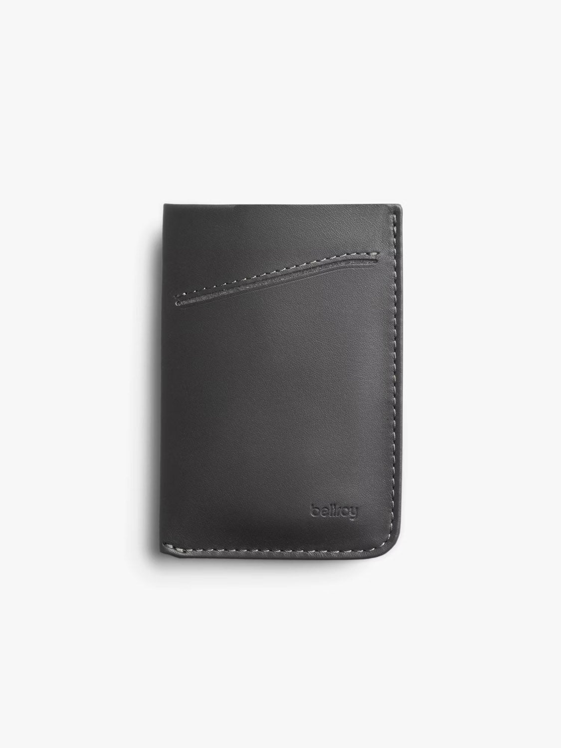 The Bellroy Card Sleeve Wallet is a black leather minimalist wallet with white edge stitching, a diagonal front card slot, and the brand name embossed in the lower right corner—a sleek option for everyday use.