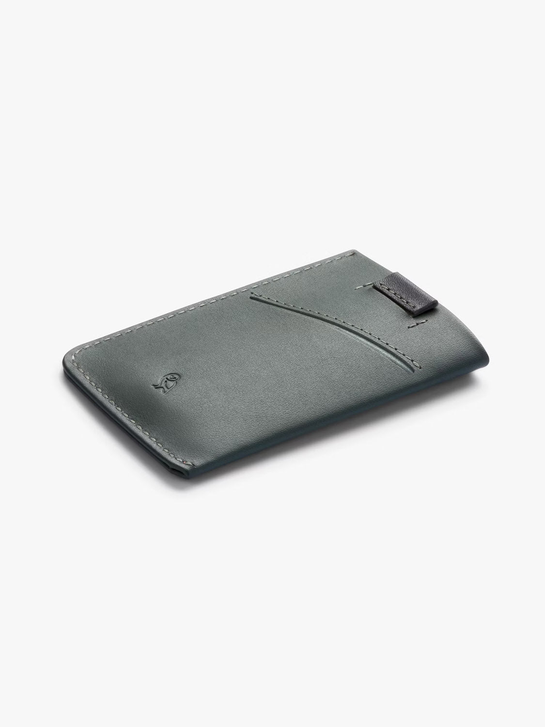 The Bellroy Card Sleeve Wallet is a slim, green leather card holder featuring a diagonal front pocket, subtle edge stitching, and a small embossed logo on the lower left corner, shown on a light gray background.