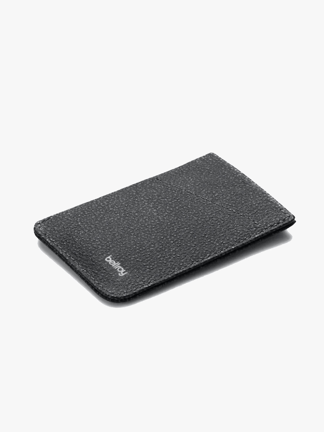 The Bellroy Card Sleeve Wallet is a slim, black premium leather wallet with a textured finish and a subtle white Bellroy logo on the bottom corner, shown against a light gray background.