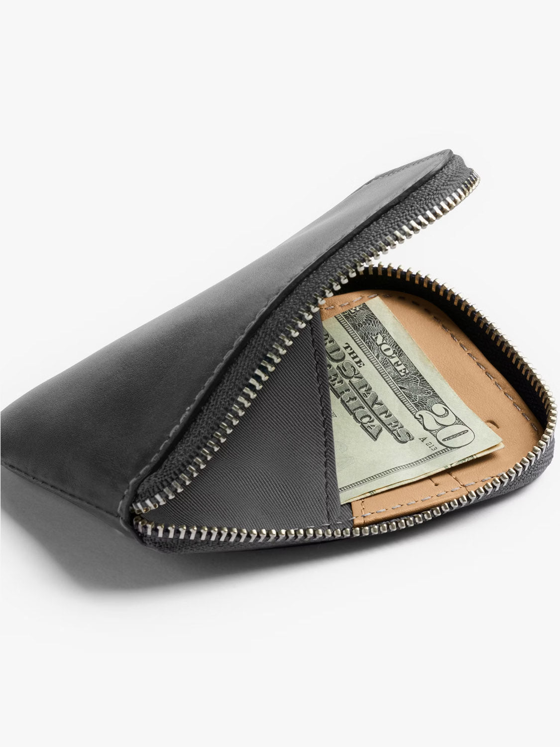 The Bellroy Card Pocket Wallet, in black leather with a zippered closure, is shown partially open to reveal folded twenty-dollar bills and a tan card—ideal for organizing your essentials.