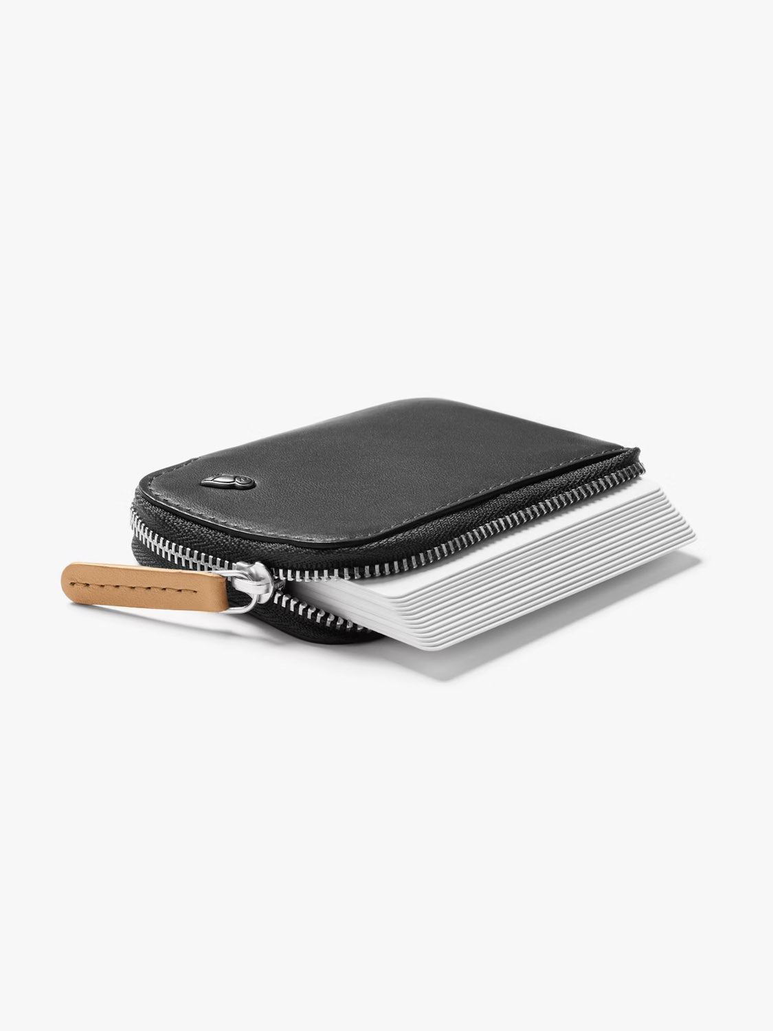 The Bellroy Card Pocket Wallet in black features a light brown zipper pull and an open design showing stacked white cards inside. This stylish coin pouch is displayed on a plain white background.
