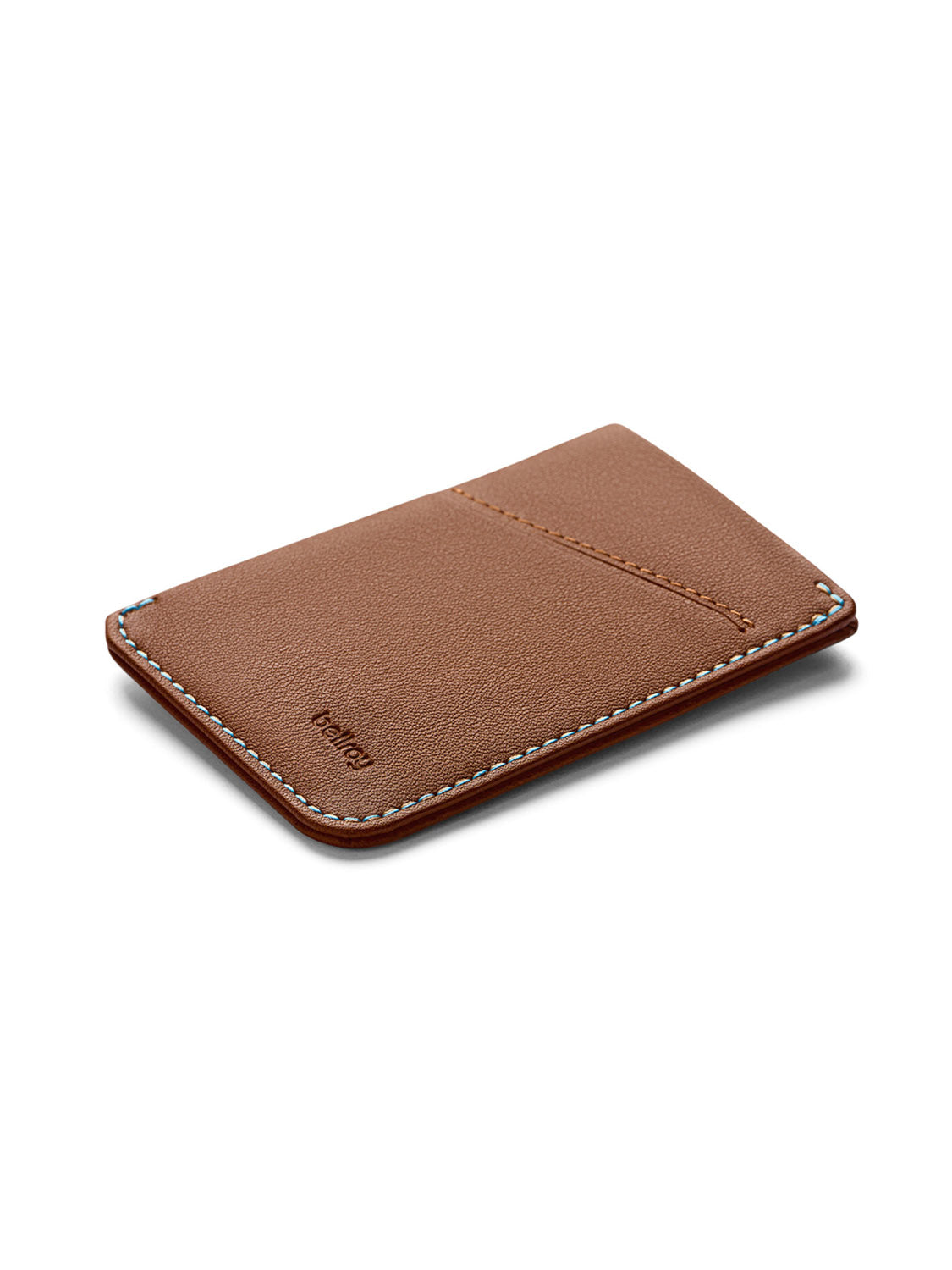 A slim, brown Bellroy Card Sleeve Wallet with white edge stitching and a diagonal front card slot. Minimalist design with &quot;Bellroy&quot; embossed on the lower left corner.