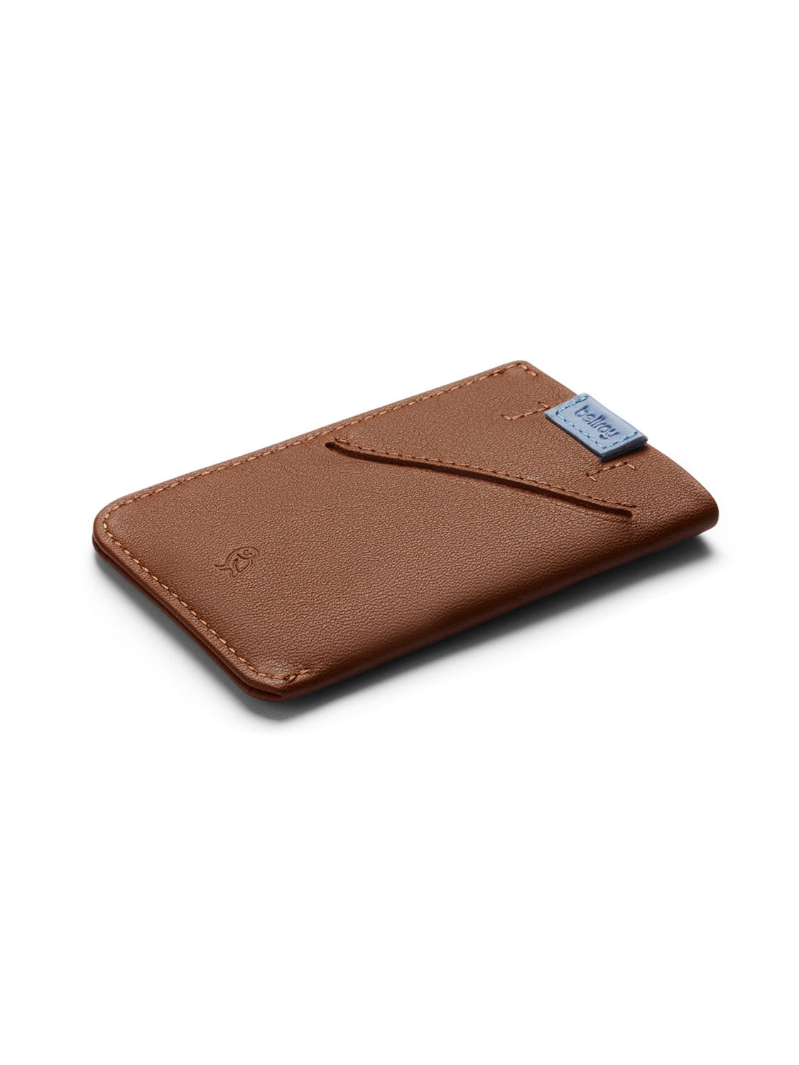 The Bellroy Card Sleeve Wallet, a slim brown leather card holder featuring a diagonal slot and a blue fabric tag at the top edge, is shown on a white background.