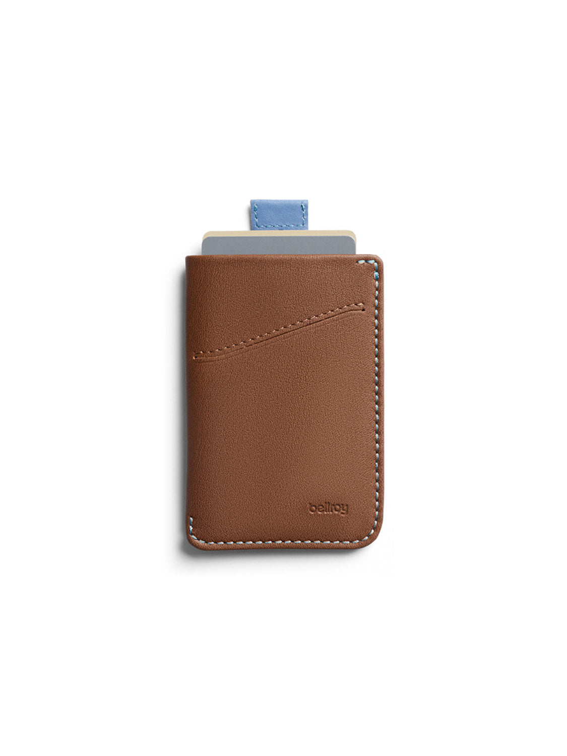 The Bellroy Card Sleeve Wallet is a slim brown leather minimalist wallet with white stitching. It holds two cards (one with a visible blue tab) and features the Bellroy brand name embossed in the lower right corner.