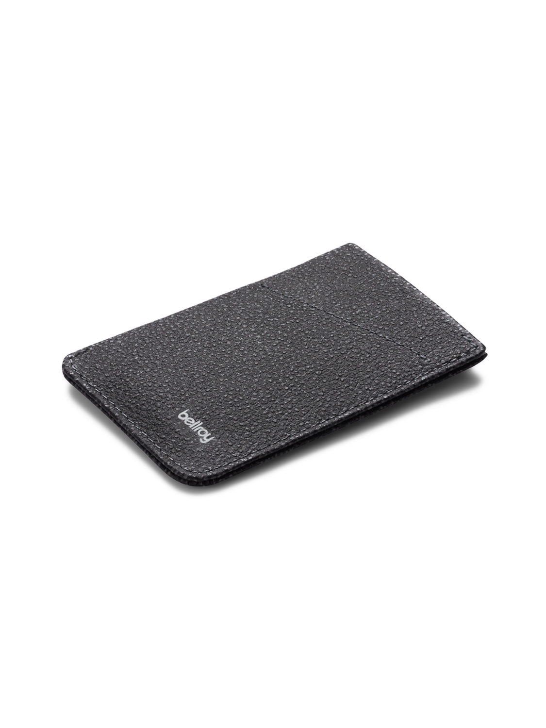 A slim, black leather Card Sleeve Wallet by Bellroy with a textured finish rests on a white background. The subtle Bellroy logo in white adds style, making this minimalist wallet an ideal business card holder for professionals.