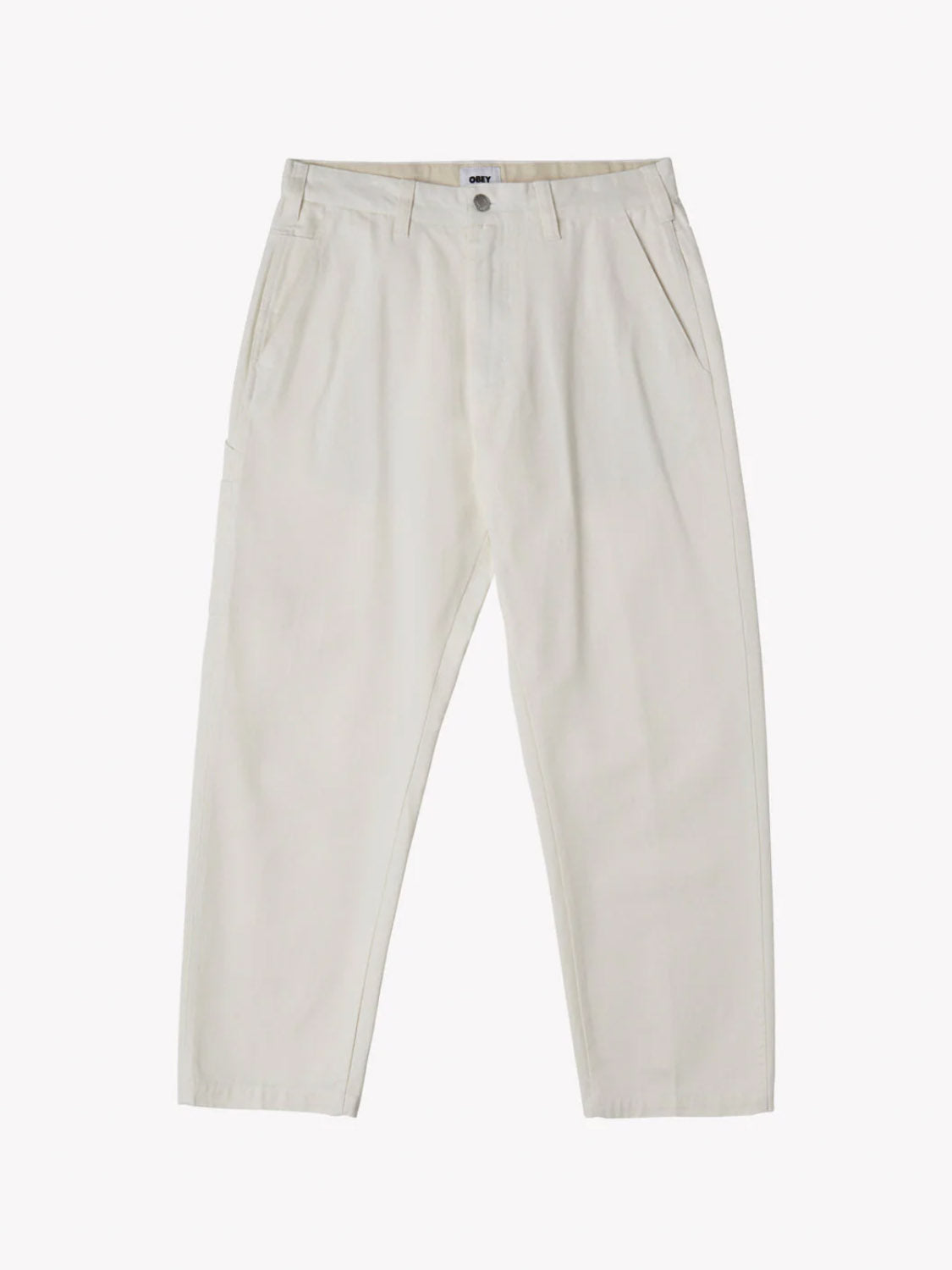 Obeys Hardwork Carpenter Pant in cream is high-waisted, made of twill, and features pleats with side carpenter pockets and a single button closure.