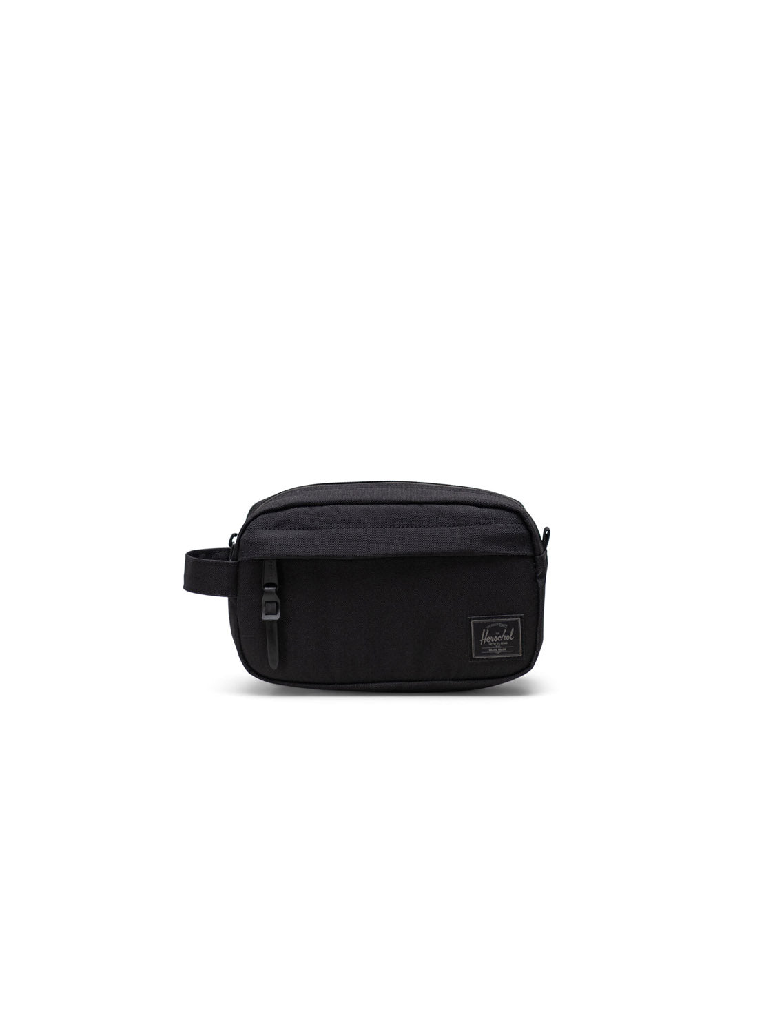 The Herschel Chapter Small Travel Kit is a compact black zippered organizer with a side handle and a rectangular Herschel logo patch on the front, displayed against a white background.