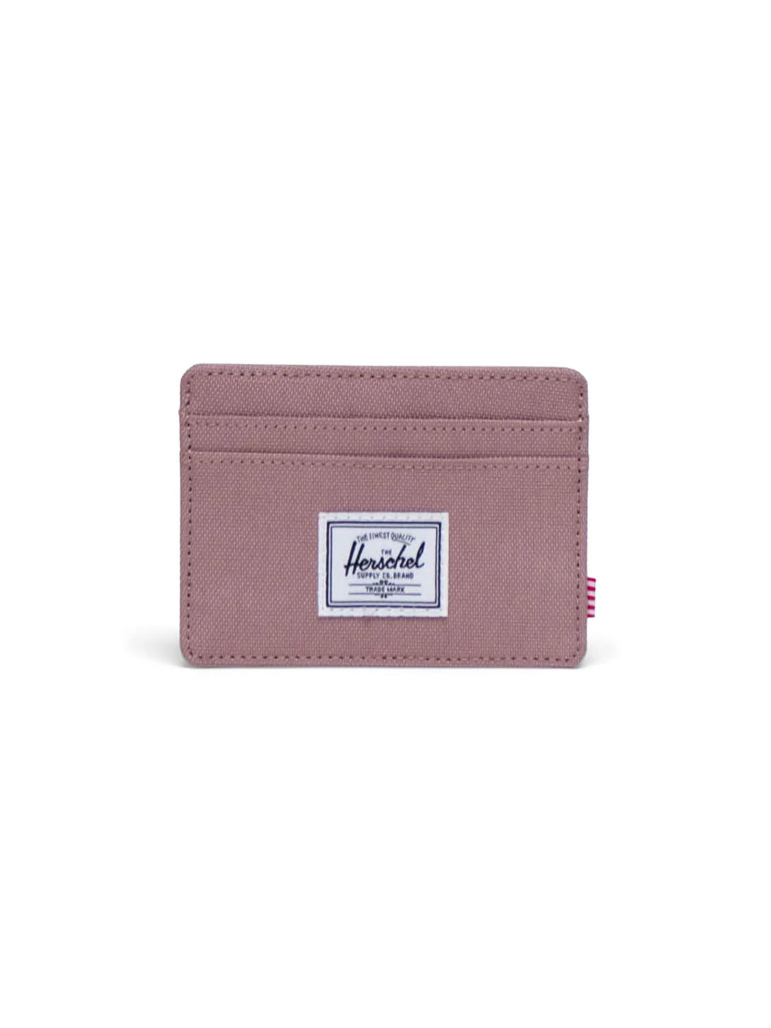 The Herschel Charlie Cardholder Wallet in mauve features two front card slots and a white rectangular Herschel Supply Co. label centered, displayed against a white background.