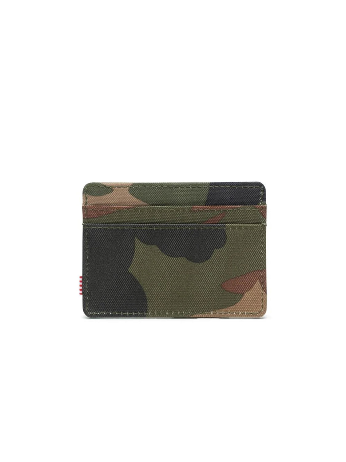 The Herschel Charlie Cardholder Wallet is a compact card holder with a green, brown, and black camo pattern, two card slots, RFID blocking technology, and a small red and white striped tag on the left edge.