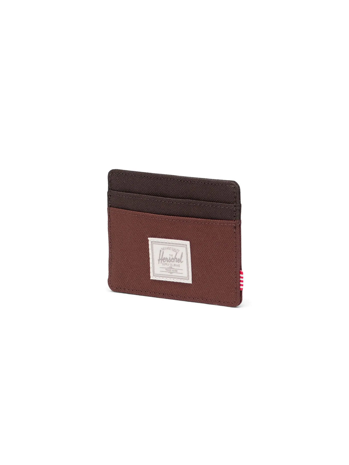The Herschel Charlie Cardholder Wallet, in brown and dark brown recycled polyester with multiple slots and a white rectangular Herschel label on the front, is displayed against a plain white background.