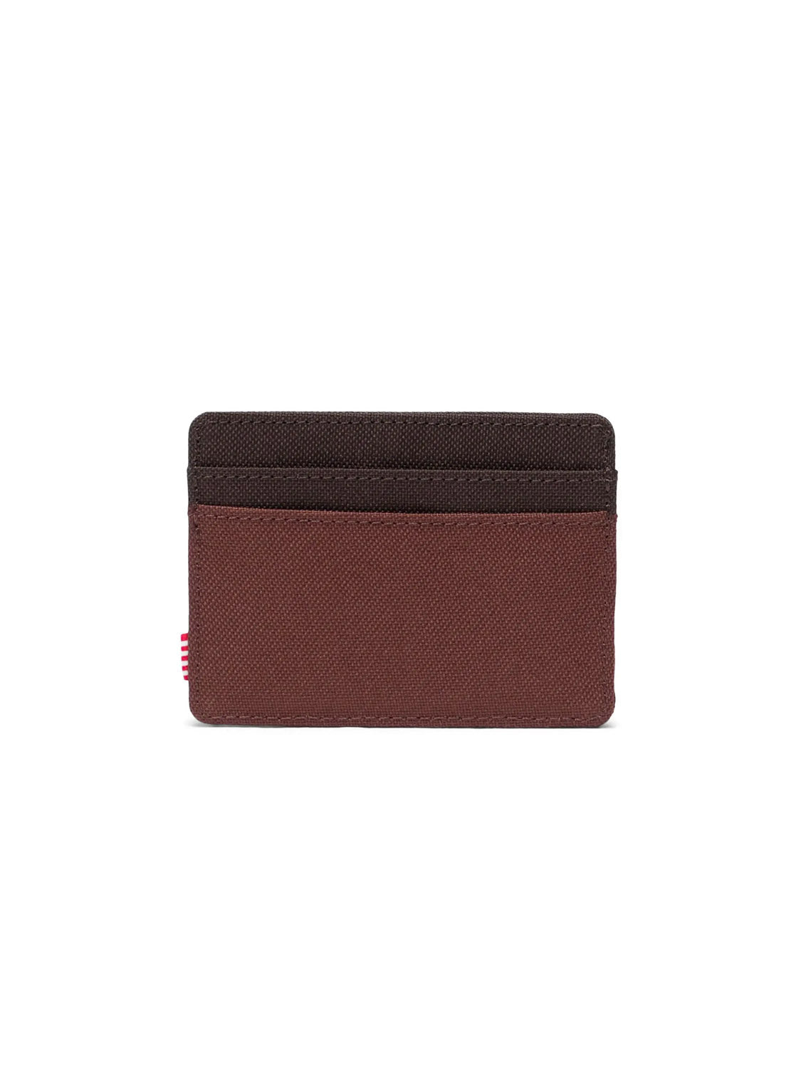 The Herschel Charlie Cardholder Wallet is a slim brown card holder featuring two dark brown card slots on top and a small red tag on the left side, displayed against a white background.